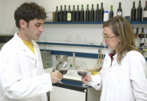 Lab technicians w_red wine
